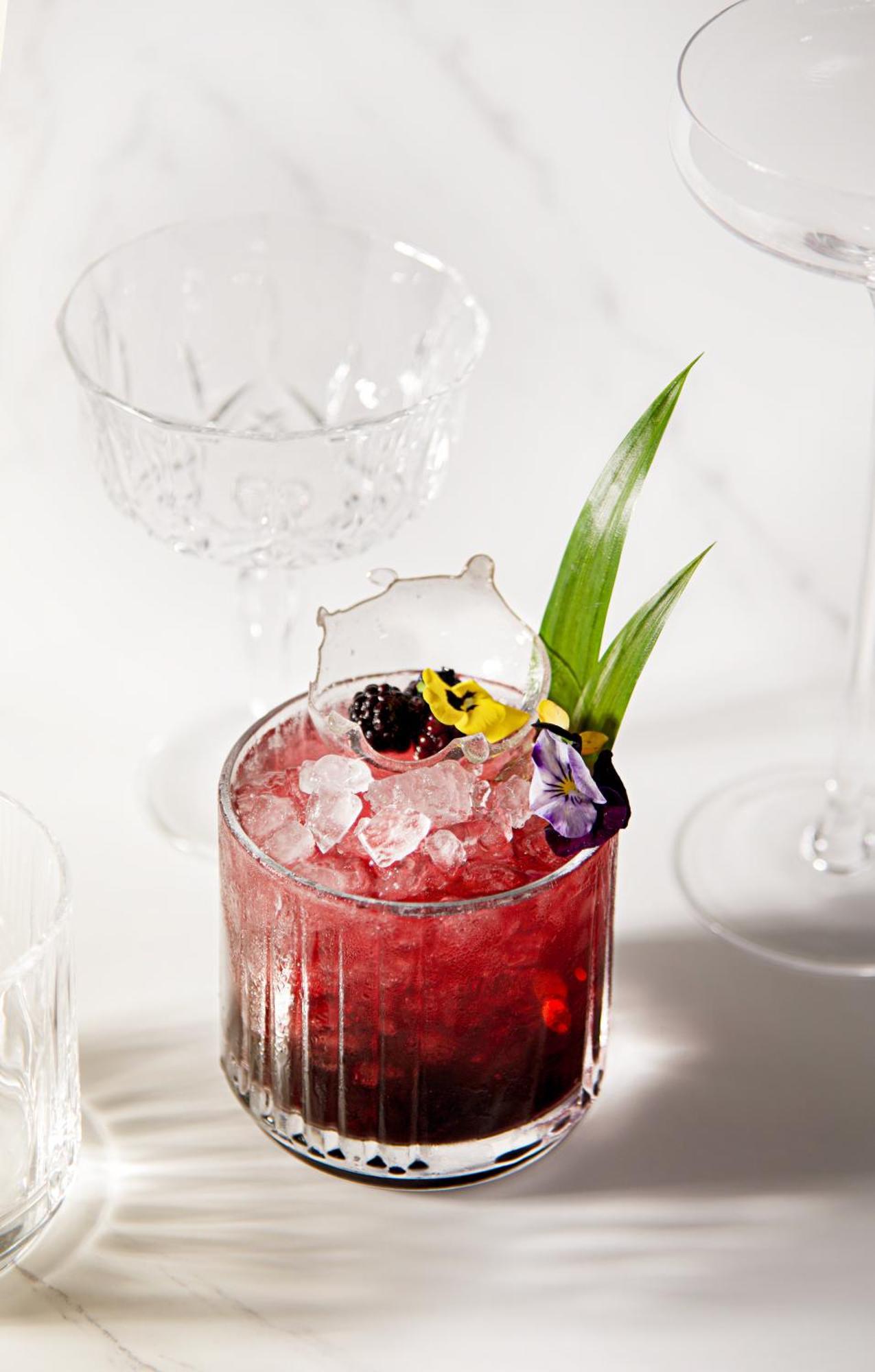 Mai House Saigon Hotel Ho Chi Minh City Bagian luar foto A cocktail garnished with edible flowers