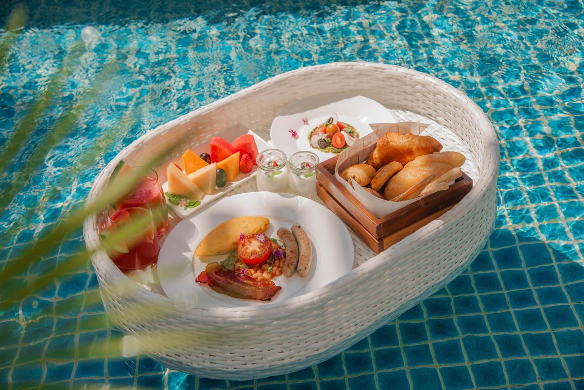 Mai House Saigon Hotel Ho Chi Minh City Bagian luar foto A floating breakfast at a resort in Bali, Indonesia